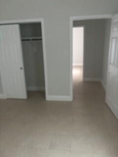 unfurnished bedroom featuring a closet