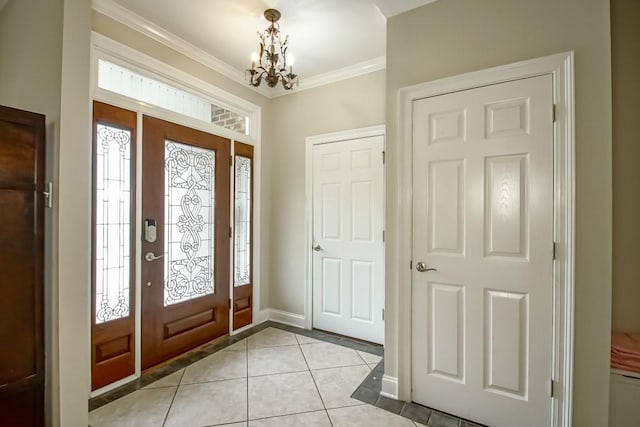 foyer featuring light tile floors, plenty of natural light, a chandelier, and crown molding