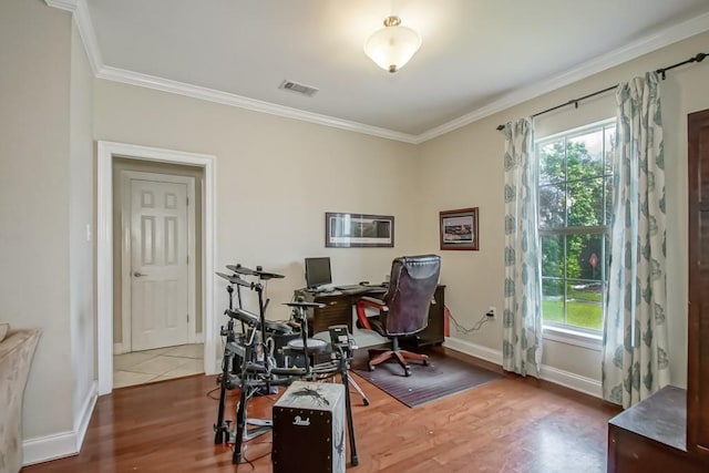 home office featuring hardwood / wood-style floors and ornamental molding