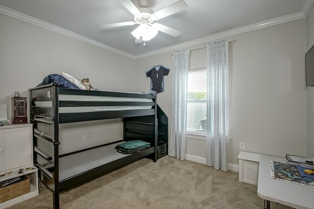 carpeted bedroom with ceiling fan and crown molding