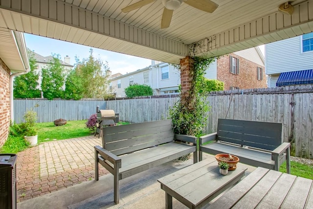 view of patio featuring area for grilling and ceiling fan