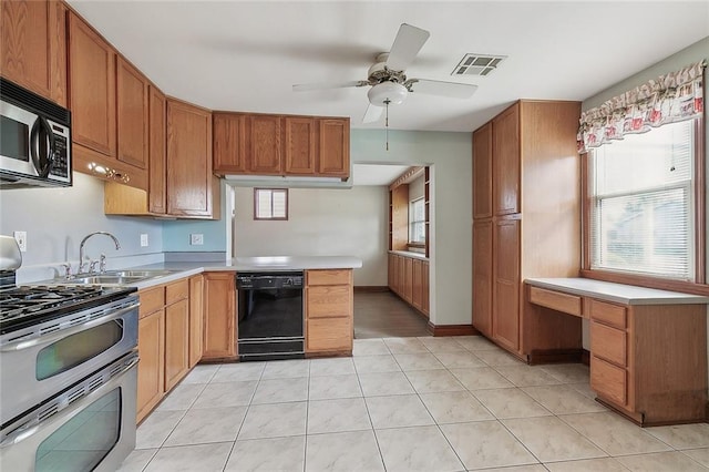 kitchen featuring light tile floors, ceiling fan, sink, and stainless steel appliances