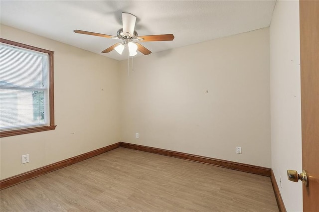 empty room featuring ceiling fan and light hardwood / wood-style flooring