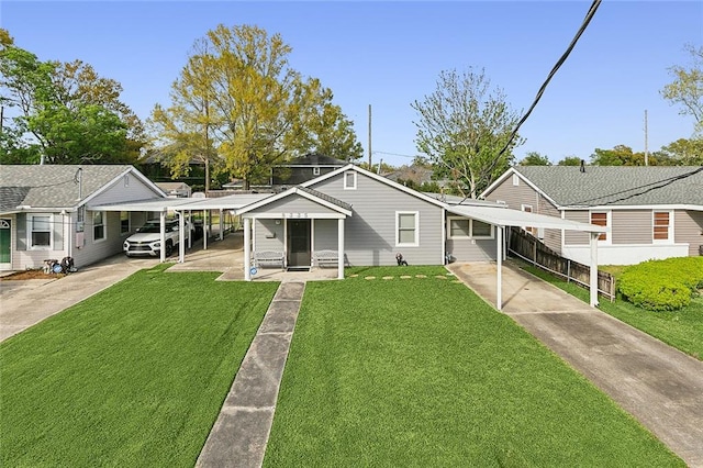 bungalow-style house featuring a carport and a front yard