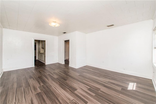 unfurnished room featuring dark wood-type flooring