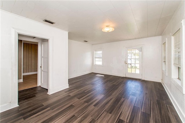 spare room with dark hardwood / wood-style flooring