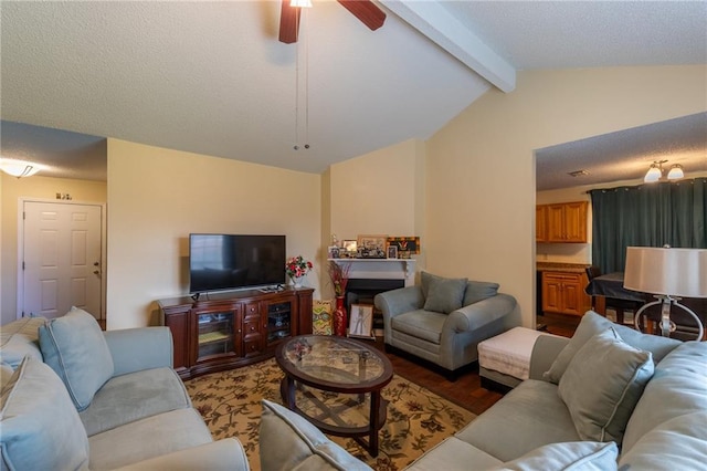 living room with ceiling fan and lofted ceiling with beams