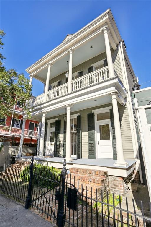 neoclassical / greek revival house with a balcony