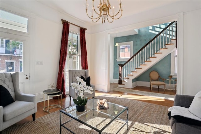 living room featuring dark hardwood / wood-style flooring and a notable chandelier