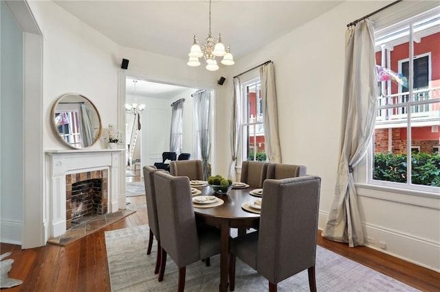 dining room with an inviting chandelier and hardwood / wood-style flooring