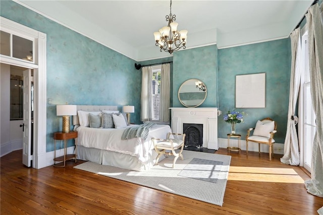 bedroom featuring a notable chandelier and dark wood-type flooring