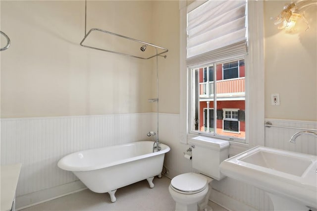 bathroom featuring toilet and sink