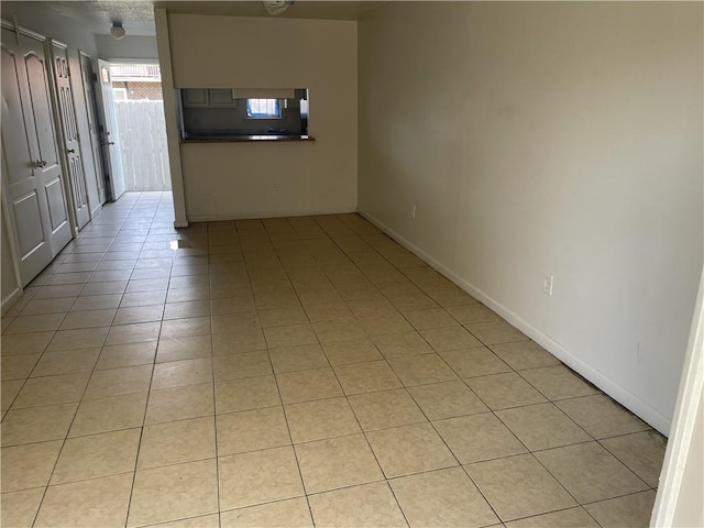 view of tiled spare room