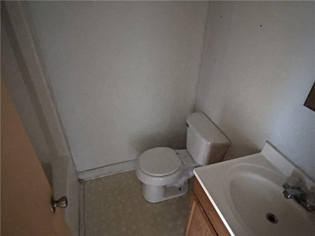 bathroom featuring toilet and vanity