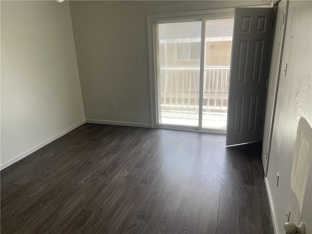 empty room with dark wood-type flooring