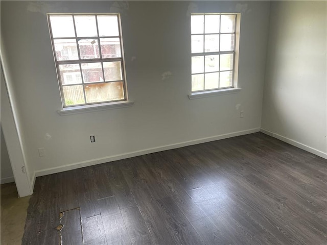 unfurnished room featuring dark hardwood / wood-style floors