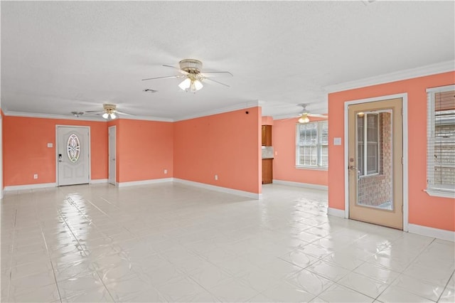 tiled spare room featuring a textured ceiling, crown molding, and ceiling fan