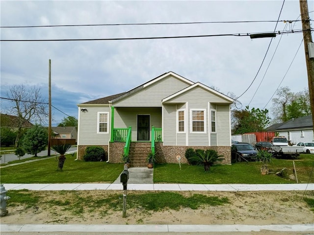 bungalow-style house with a porch and a front yard