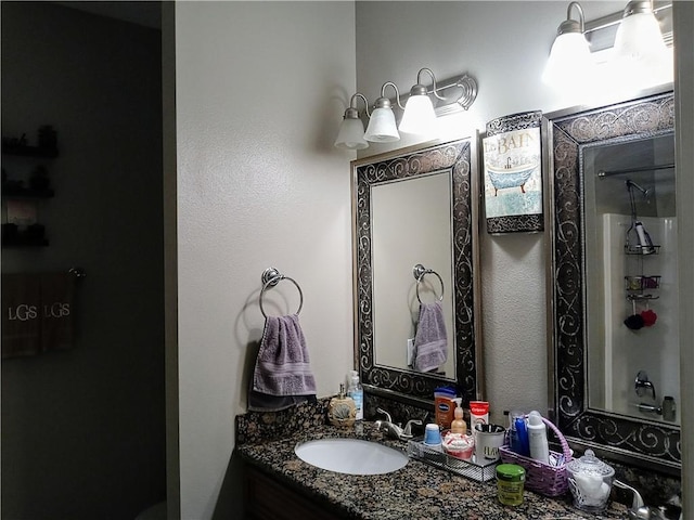 bathroom featuring vanity and a shower