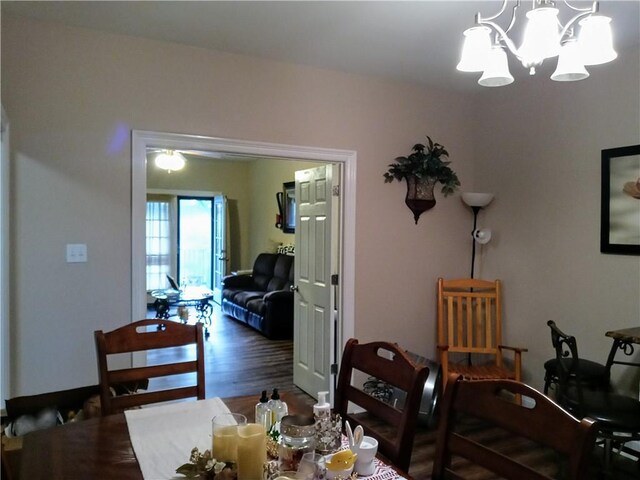 dining space with a notable chandelier