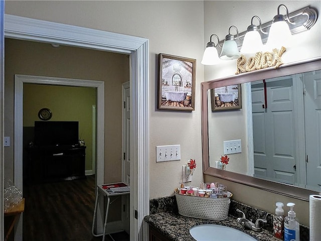 bathroom featuring hardwood / wood-style floors and vanity