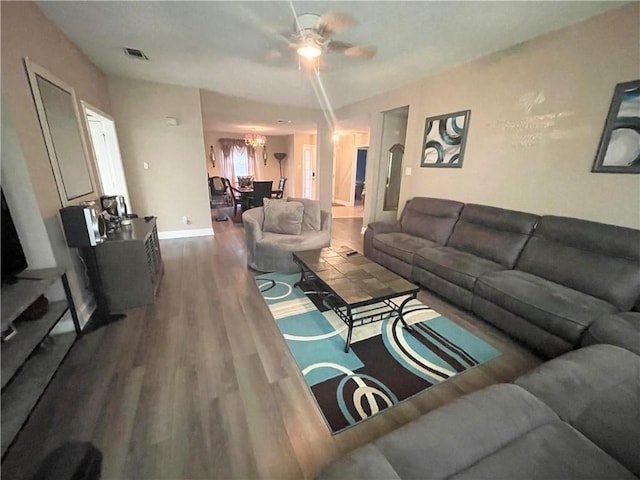 living room featuring ceiling fan and hardwood / wood-style floors