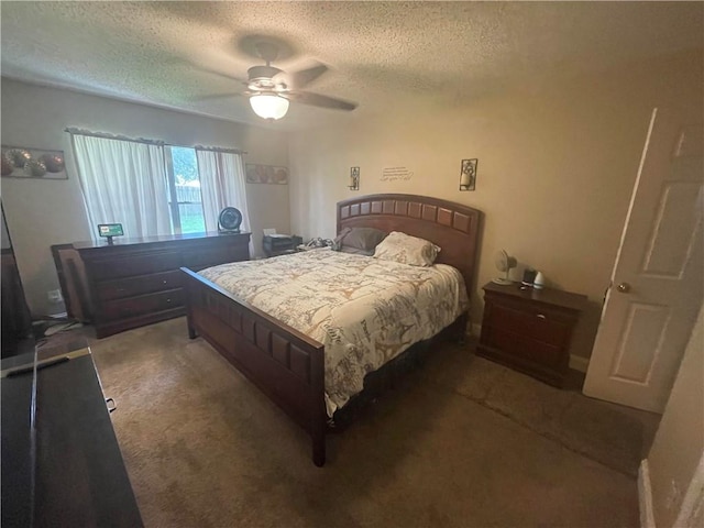 carpeted bedroom with a textured ceiling and ceiling fan