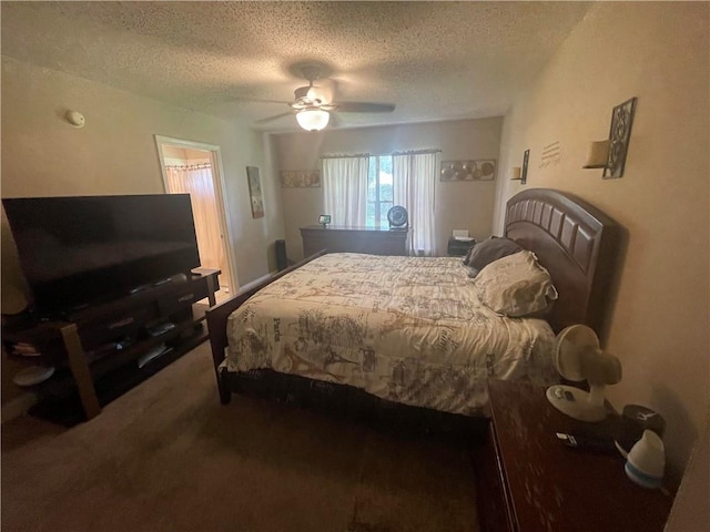 carpeted bedroom featuring a textured ceiling and ceiling fan