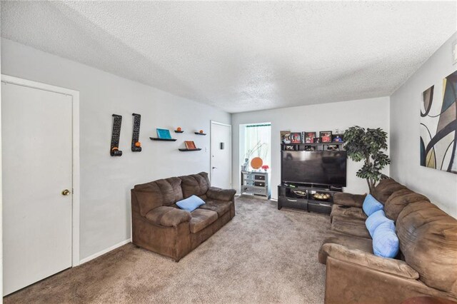 living room with light carpet and a textured ceiling