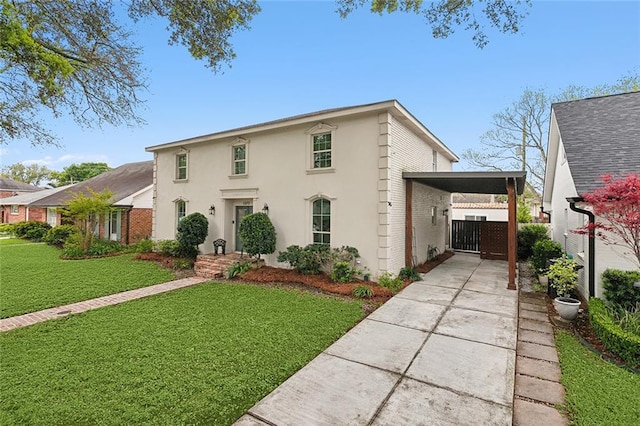 view of front of house featuring a front yard and a carport