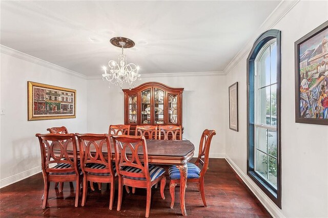 dining space with dark hardwood / wood-style floors, crown molding, and a healthy amount of sunlight