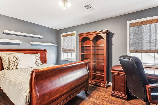 bedroom with wood-type flooring