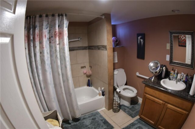 full bathroom with tile flooring, shower / bath combination with curtain, toilet, and vanity