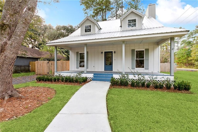 view of front facade with a porch and a front lawn