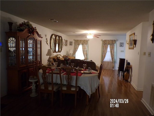 dining space featuring dark hardwood / wood-style floors and ceiling fan