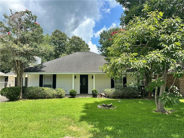 2415 Biron St, Mandeville, LA 70448 - view of front facade featuring a front yard, roof with shingles, and a chimney