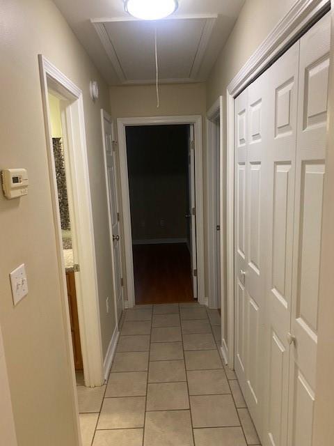 2415 Biron St, Mandeville, LA 70448 - hall featuring attic access and light tile patterned floors