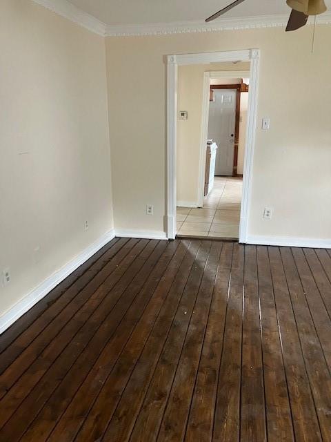 unfurnished room with hardwood / wood-style floors, ceiling fan, and ornamental molding