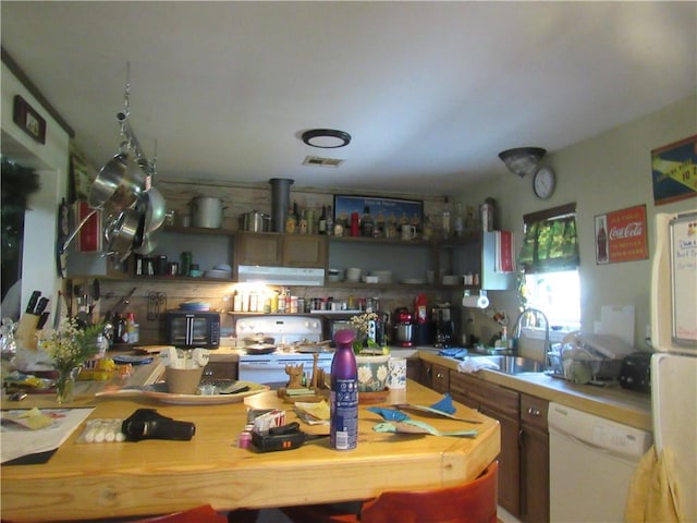 kitchen with sink and white appliances