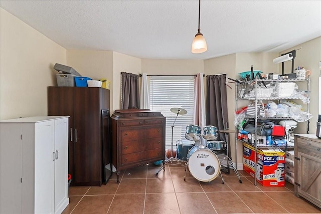 interior space featuring dark tile floors