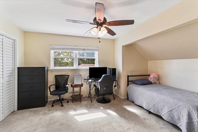 carpeted bedroom featuring ceiling fan and vaulted ceiling