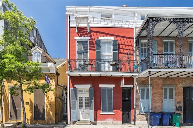 rear view of house featuring a balcony