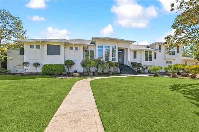 view of front of home with a front yard