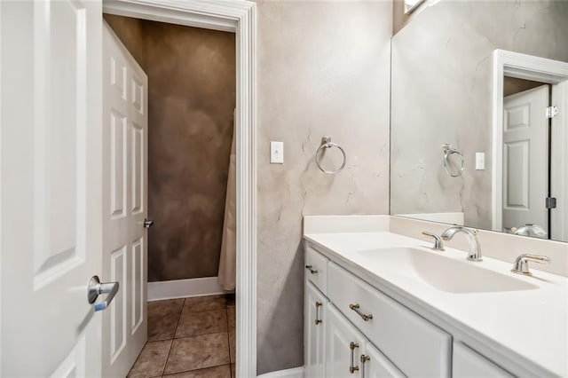 bathroom with large vanity and tile floors