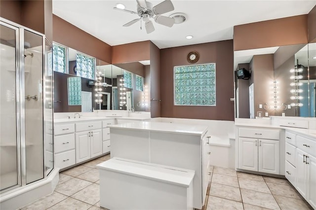 bathroom featuring a shower with shower door, vanity, ceiling fan, and tile flooring