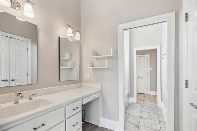 bathroom featuring tile flooring and vanity