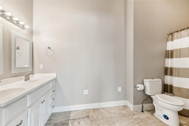 bathroom with double vanity, toilet, and tile flooring