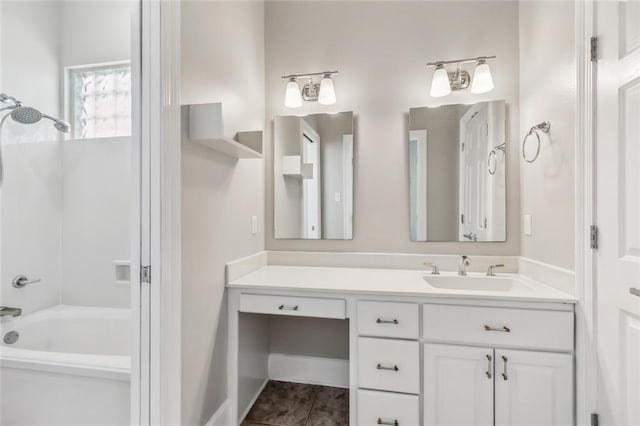 bathroom with shower / bathing tub combination, tile floors, and vanity