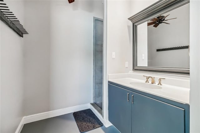 bathroom featuring a shower, vanity with extensive cabinet space, and ceiling fan