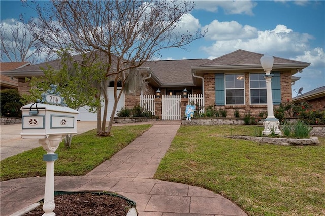 view of front of home featuring a garage and a front yard